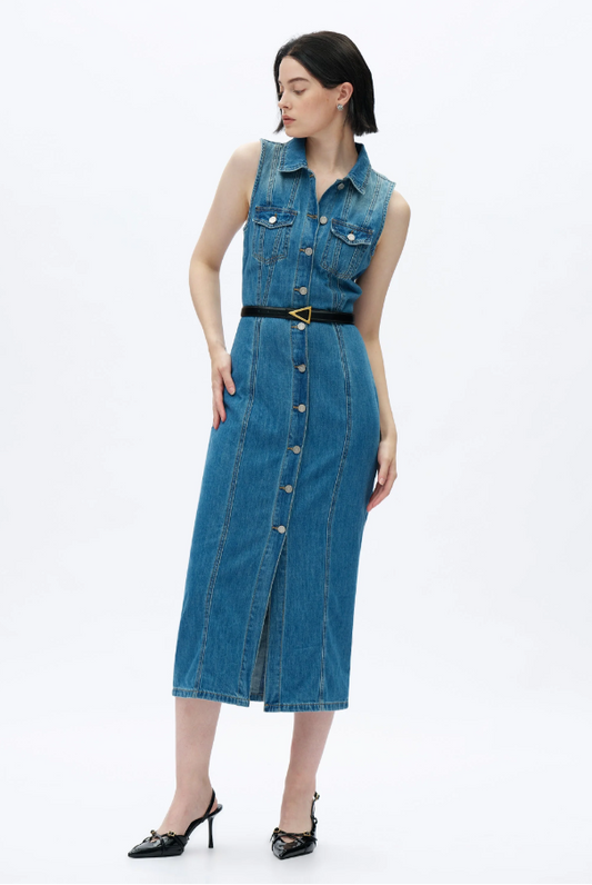 Woman wearing a blue denim dress on a white background
