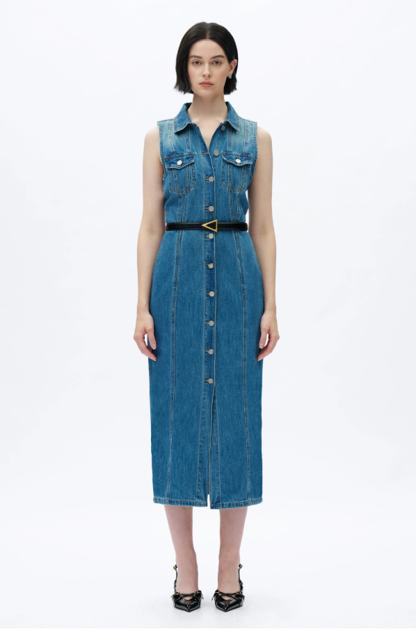 Woman wearing a blue denim dress on a white background