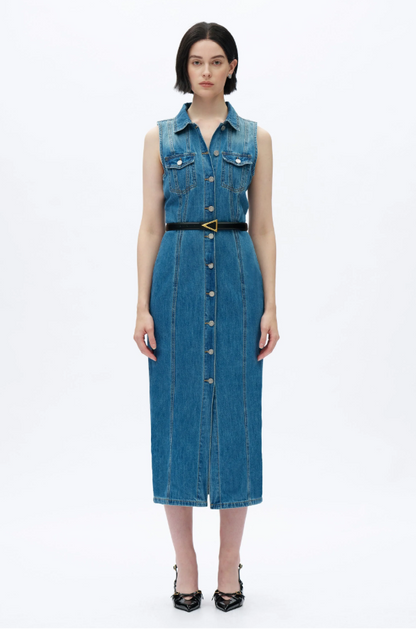 Woman wearing a blue denim dress on a white background