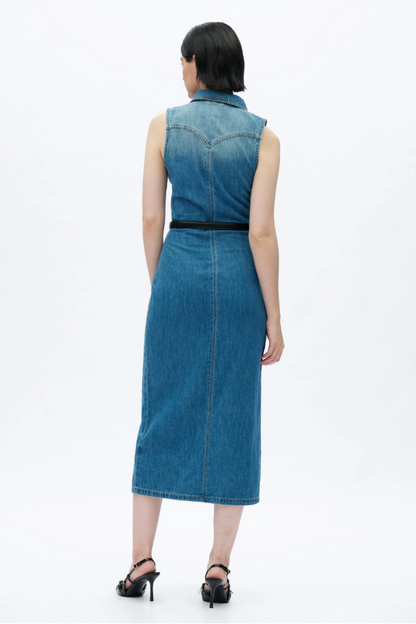 Woman wearing a blue denim dress on a white background