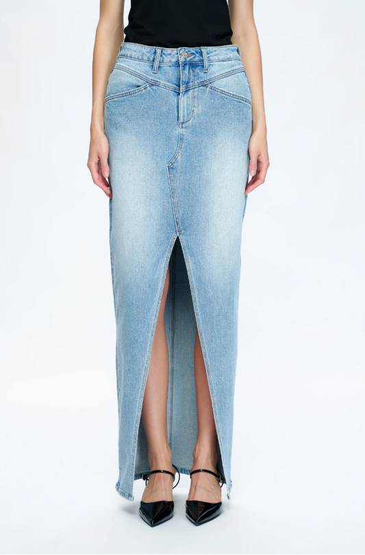 Long denim skirt with a front slit worn by a person on a white background