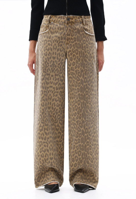Leopard print pants worn by a person on a white background